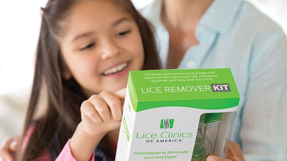 Mom & daughter reading the box of the Lice Remover Kit by Lice Clinics of America - Columbus, OH