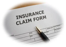Insurance claim form with a pen on the document