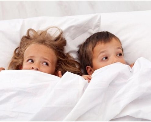 Kids in bed afraid because they do not know how to get rid of lice at home